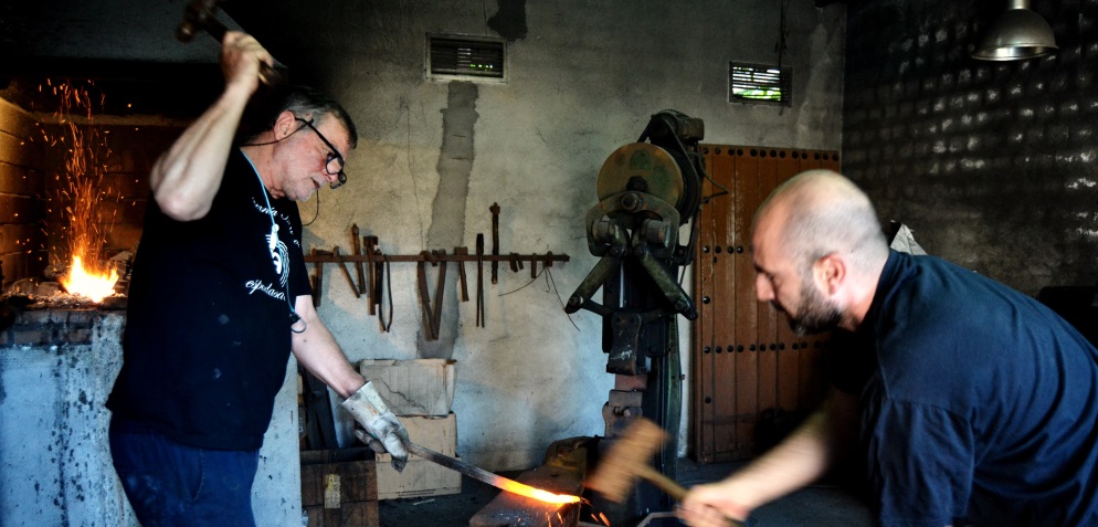 Antonio Arellano and his son forge a handcraft blade from Toledo